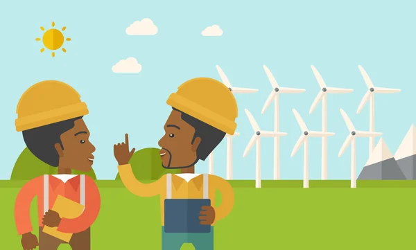 Dos trabajadores negros hablando frente a molinos de viento . — Vector de stock