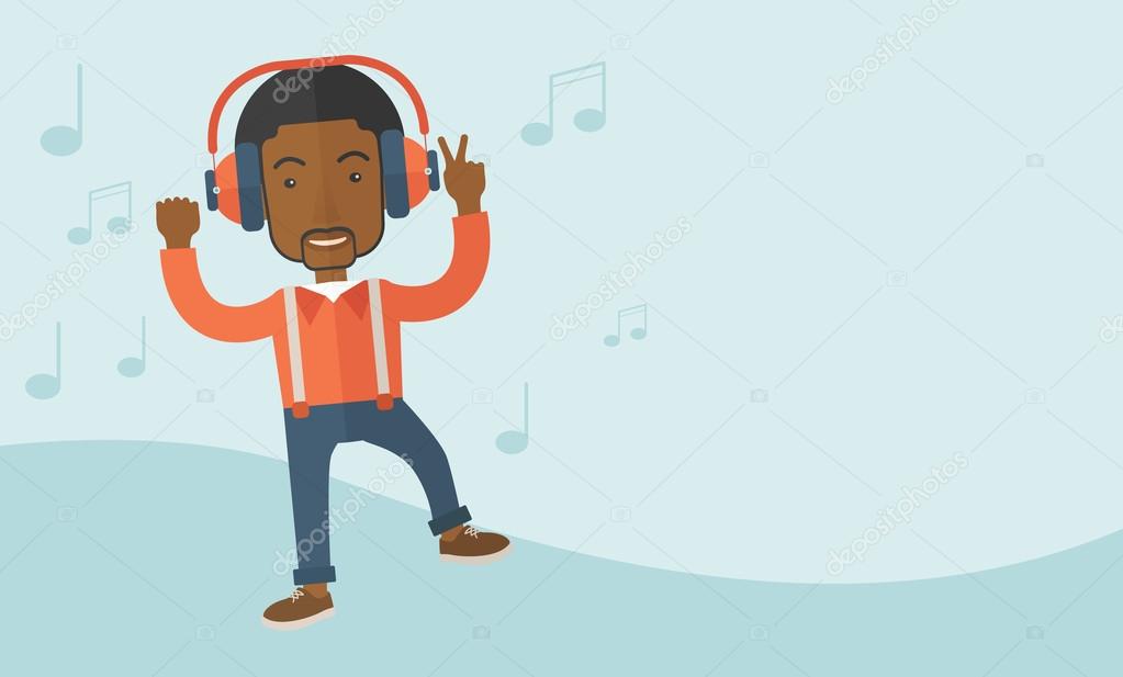 Happy young man dancing while listening to music.