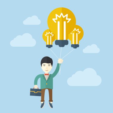 Asian businessman carrying a briefcase with bulb.