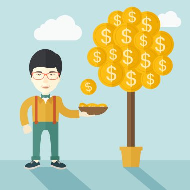 Successful chinese businessman standing while catching a dollar coin.