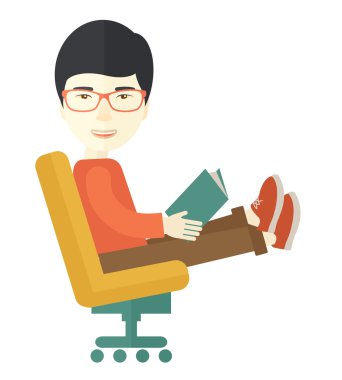 Asian Man sitting with a book