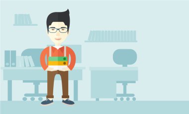 Asian man standing inside his office.