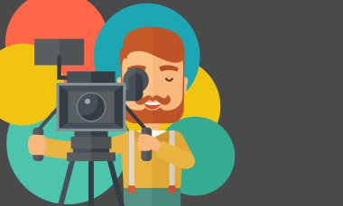 Videographer and his video cam with stand.