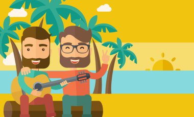 Two men playing a guitar at the beach