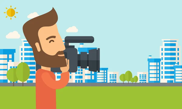 Camarógrafo con cámara de vídeo — Vector de stock