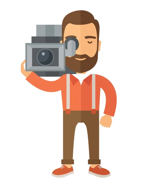 Видеооператор со своей видеокамерой — стоковый вектор