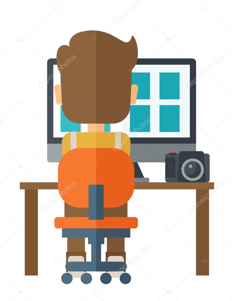 Man with laptop and camera on a table.