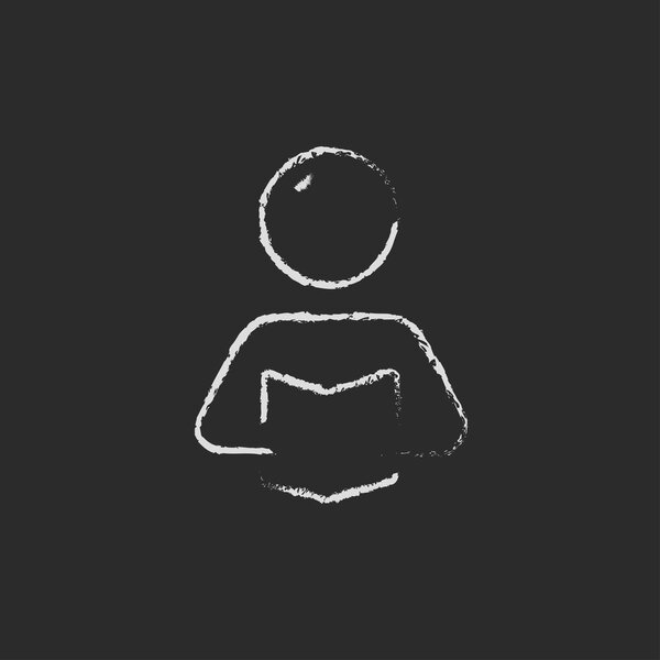 Человек, читающий иконку книги, нарисованную мелом
.