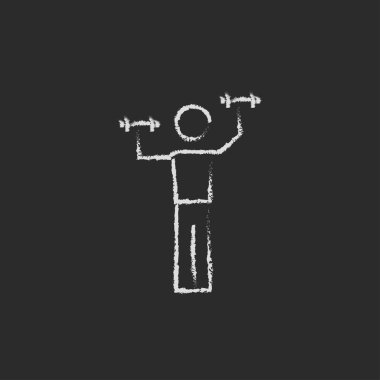 Tebeşirle çizilmiş dumbbell simgesi olan adam.