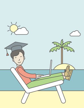 Man in graduation cap on seashore.