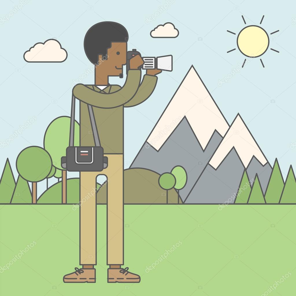 Photographer taking photo in mountains