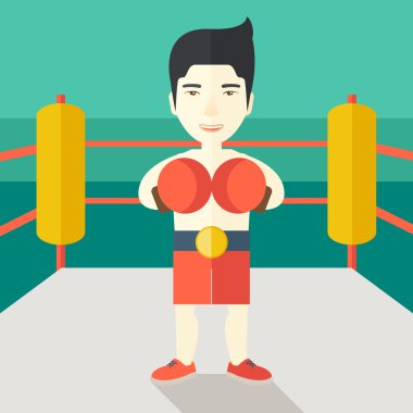 Boxer in gloves standing on ring.