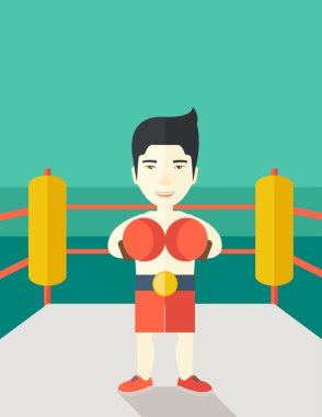 Boxer in gloves standing on ring.