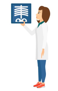 Doctor holding radiograph.