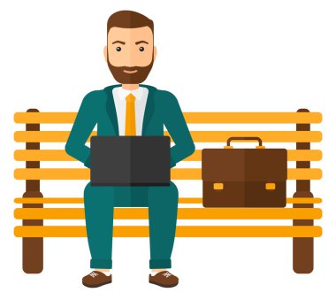 Dizüstü bilgisayarda çalışan adam.