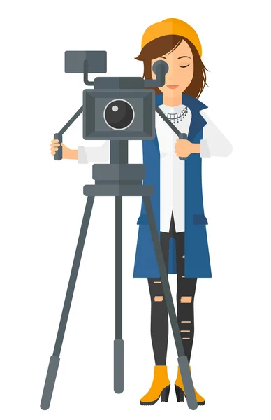 Camerawoman con cámara de cine . — Vector de stock