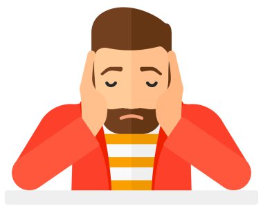 Anxious man clutching his head.