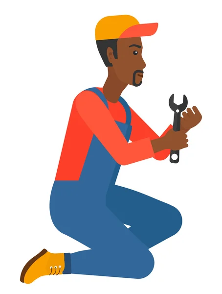 Repairman holding spanner. — Stock Vector