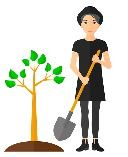 Женщина сажает дерево . — стоковый вектор