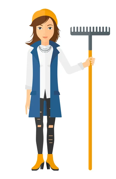 Woman standing with rake. — Stock Vector