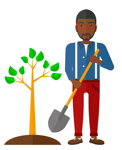 El hombre planta árbol . — Vector de stock