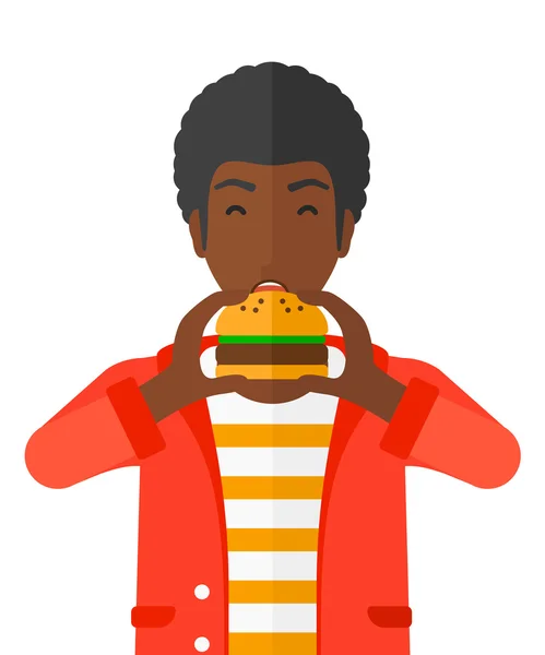Людина їсть гамбургер . — стоковий вектор