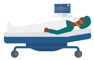 Patient lying in bed with heart monitor.