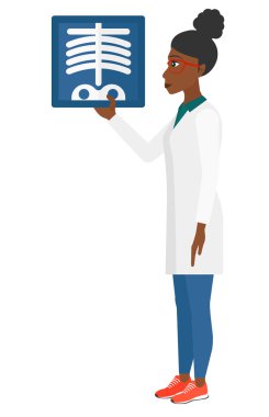 Doctor holding radiograph.