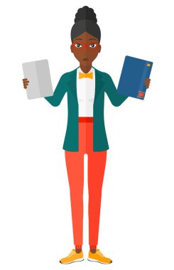 Woman choosing between book and tablet.