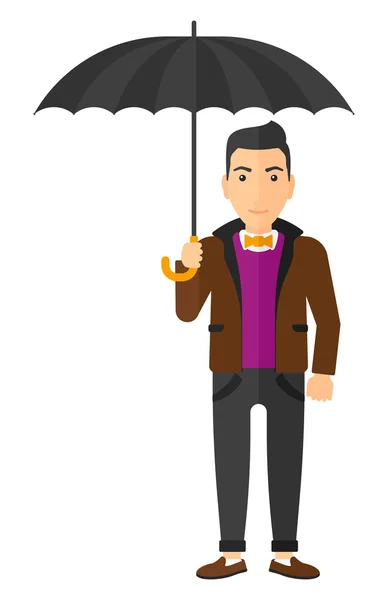 Affärsman står med paraply. — Stock vektor