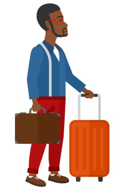 Man with suitcase on wheels and briefcase.