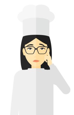 Chef pointing forefinger up.