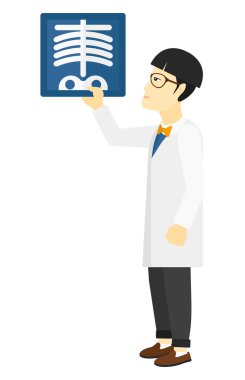 Doctor holding radiograph.