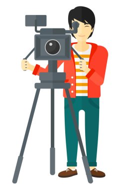 Cameraman with movie camera.