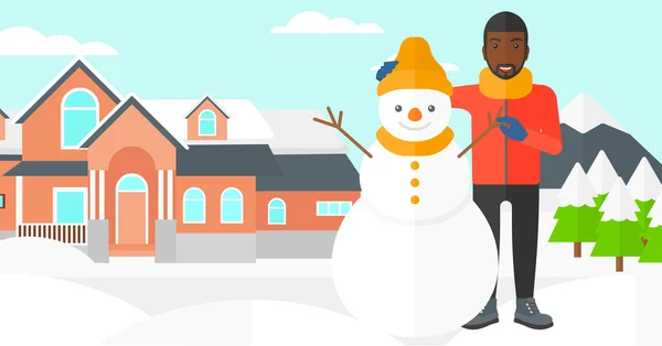 Homme posant près de bonhomme de neige . — Image vectorielle