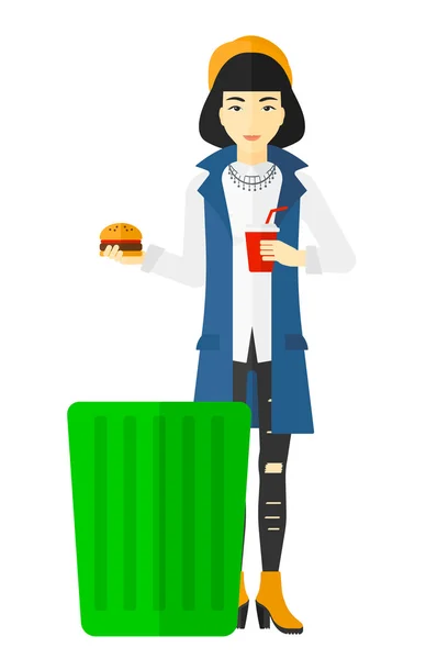 Mujer lanzando comida chatarra . — Vector de stock