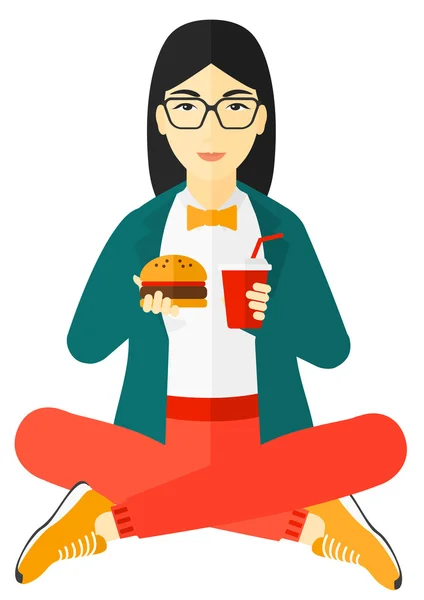 Donna che mangia hamburger . — Vettoriale Stock