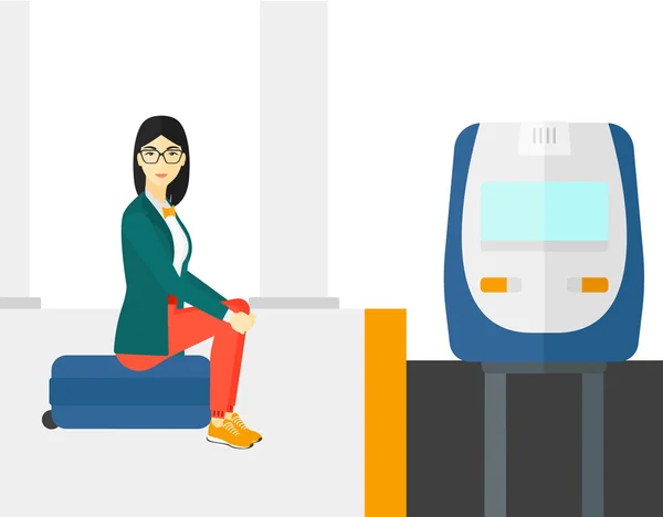 Mujer sentada en la plataforma ferroviaria . — Vector de stock