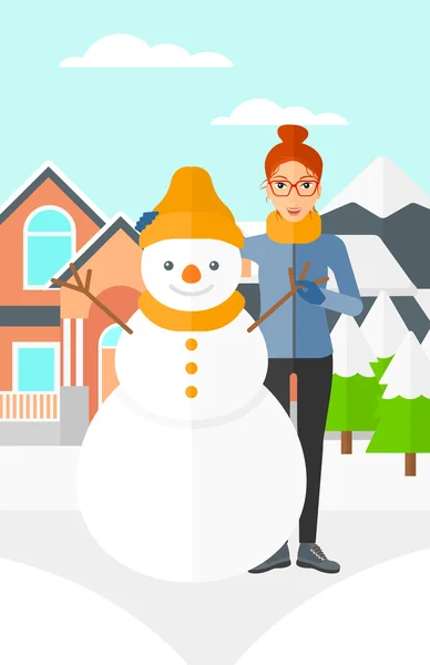 Mujer posando cerca de snowman . — Vector de stock