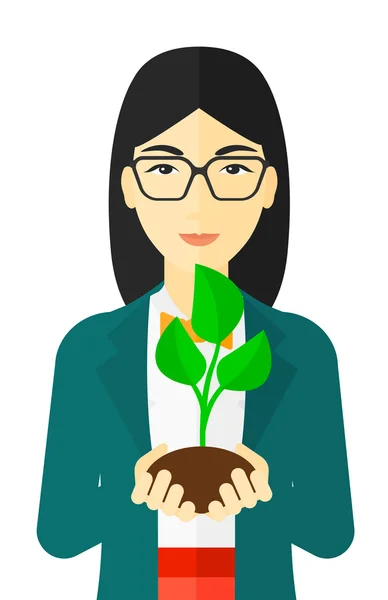 女人控股植物. — 图库矢量图片