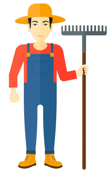 Farmer with rake. — Stock Vector