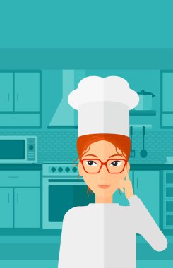 Chef pointing forefinger up.