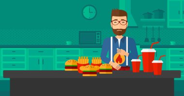 Mide ekşimesi muzdarip adam.