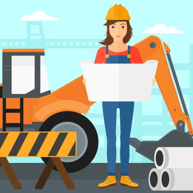 Bir plan tutan mühendisi.