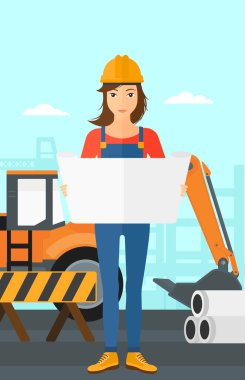 Bir plan tutan mühendisi.