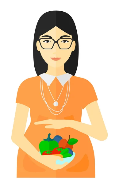 Femme enceinte avec des légumes . — Image vectorielle