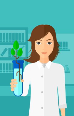 Test tüplü laboratuar asistanı.