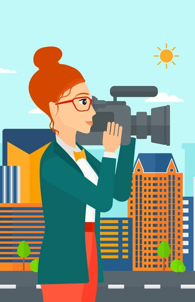 Camerawoman con telecamera . — Vettoriale Stock