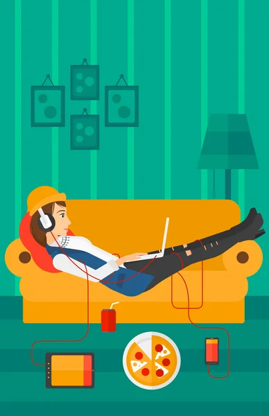 Woman lying on sofa with many gadgets. — Stock Vector