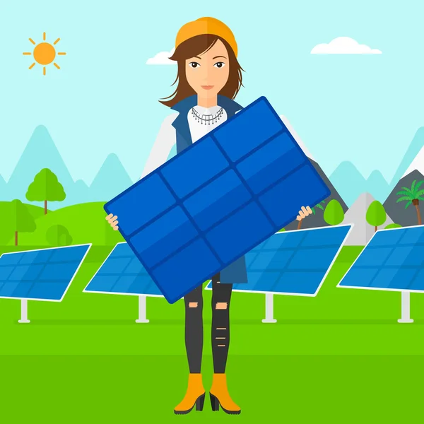 Mulher segurando painel solar . —  Vetores de Stock
